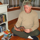 Clinton browses the current holdings of his DVD library.